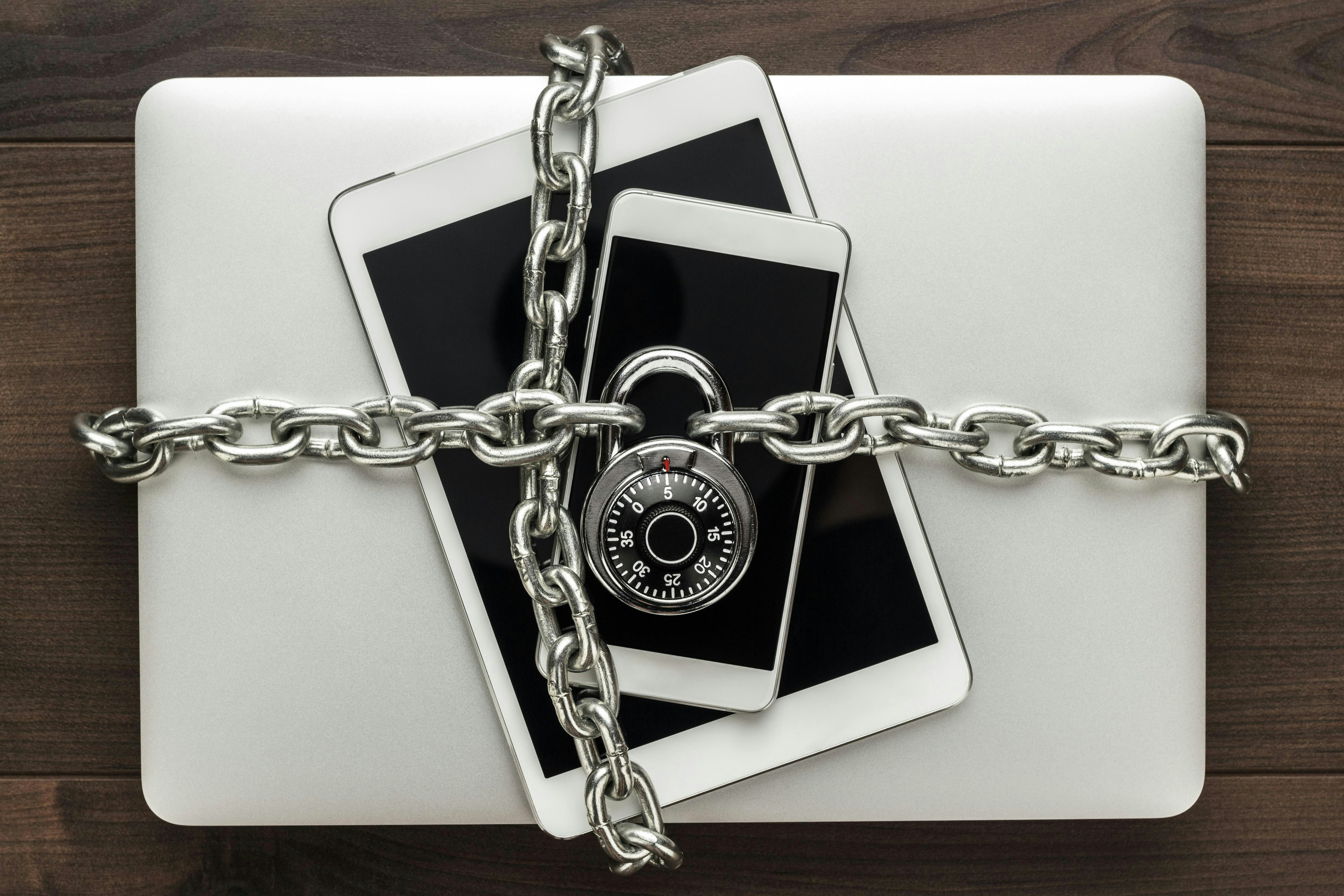 Laptop, tablet and mobile phone chained and locked with a combination lock