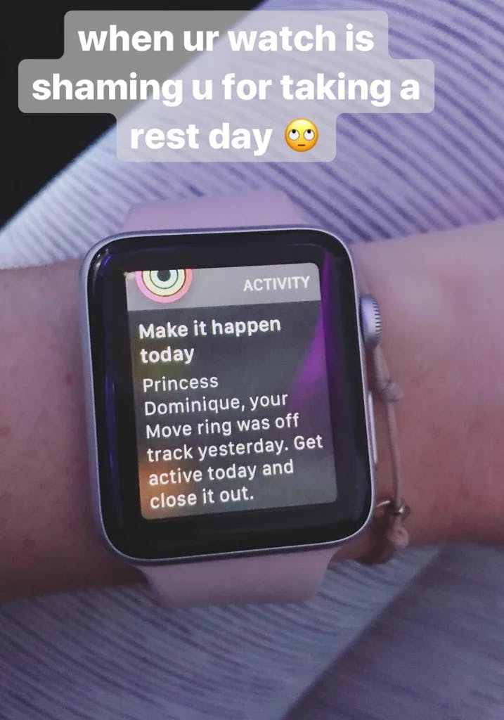 Smartwatch on person's arm with a message from the fitness application